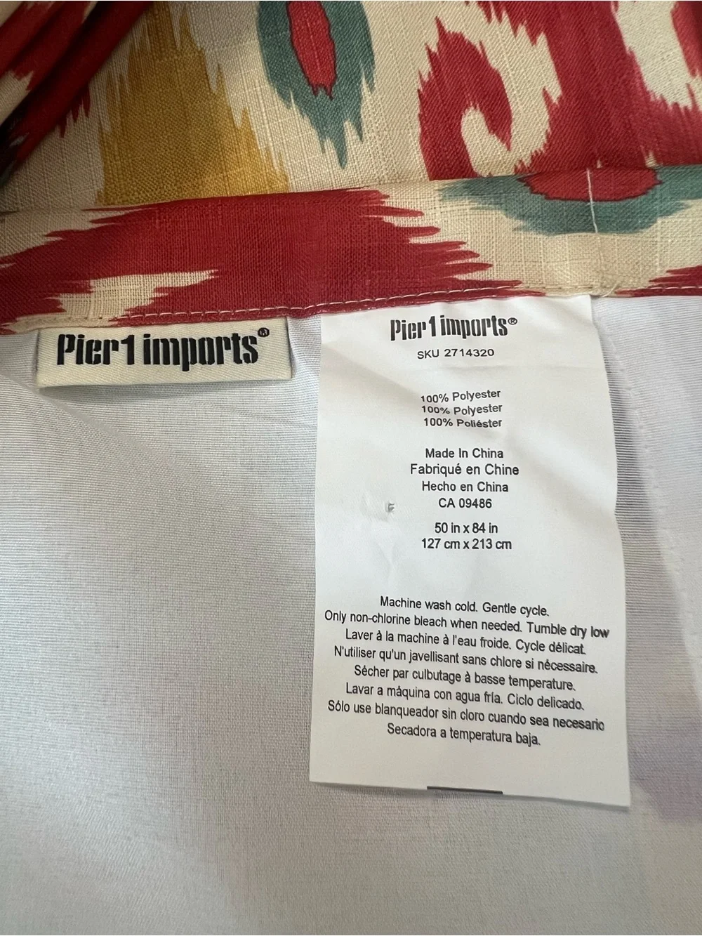Pier 1 Imports pair of Patterned brass Grommet IKAT Curtain Panels 50” X 84”